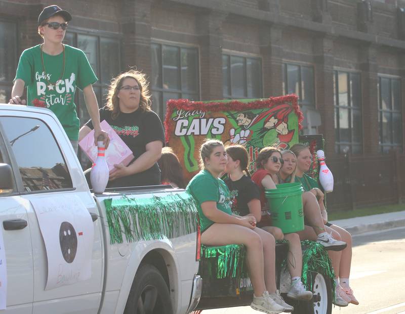 Members of the L-P bowling team ride on a float during the L-P homecoming parade on Thursday, Oct. 2, 2025 downtown Peru.