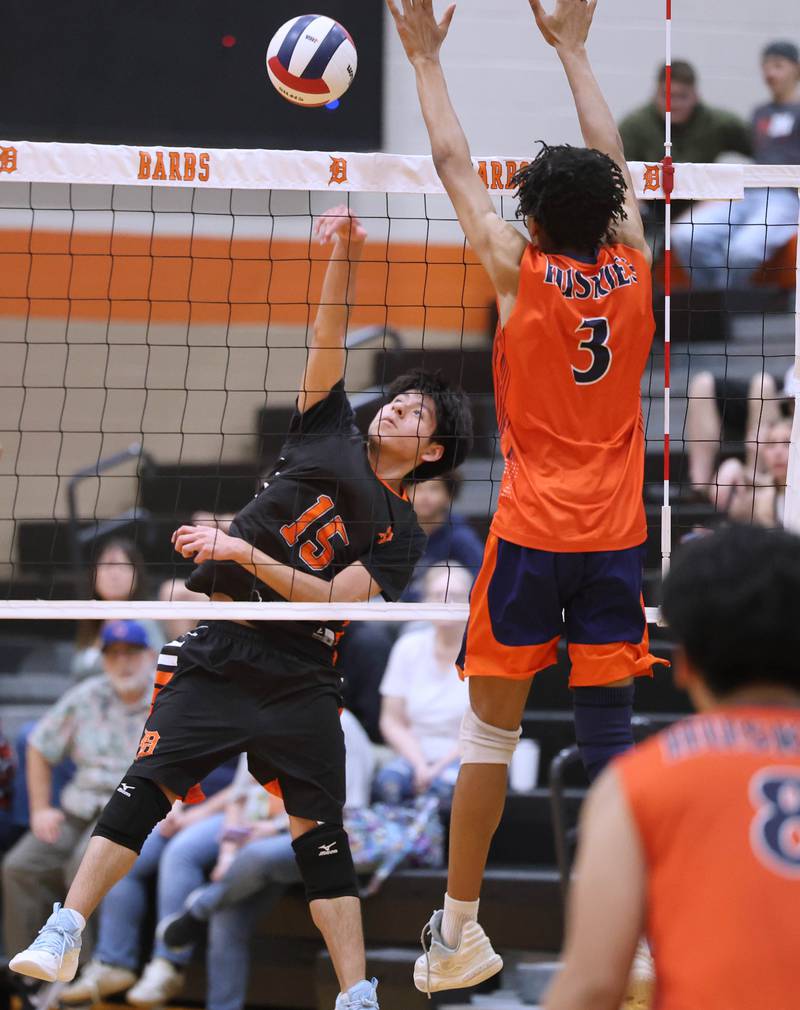 DeKalb’s Jencarlos Alba Salazar spikes the ball Tuesday, April 21, 2026 during their match against Naperville North JV at DeKalb High School.