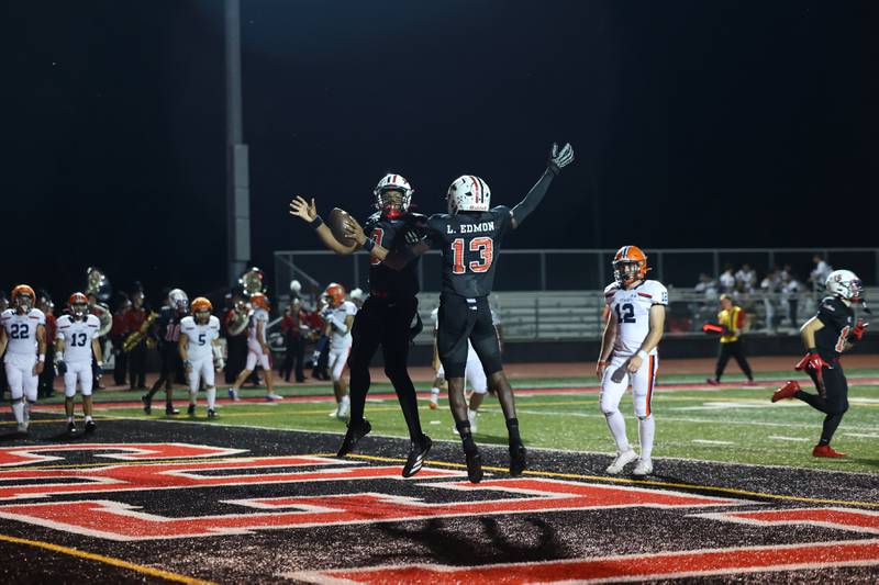 Bradley-Bourbonnais' Dachaun Anderson celebrates his touchdown with teammate LyZale Edmon (13) during the Boilermakers' victory over Stagg on Friday, Sept. 26, 2025.