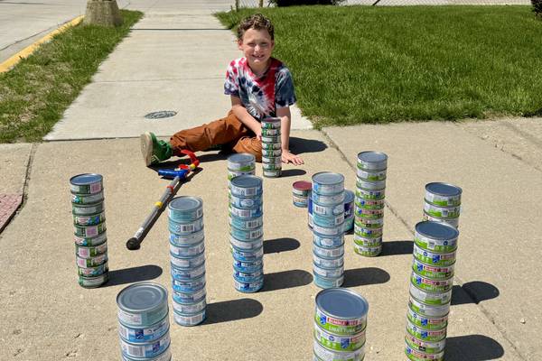 Marseilles boy again collecting tuna for the Marseilles Food Pantry