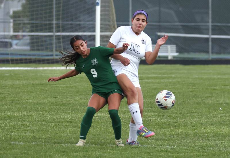 Kaneland's Adriana Warrington (right) and Boylan's Delilah Hawley arrive at the ball simultaneously Wednesday, May 28, 2025, during their Class 2A sectional semifinal game at Belvidere High School.