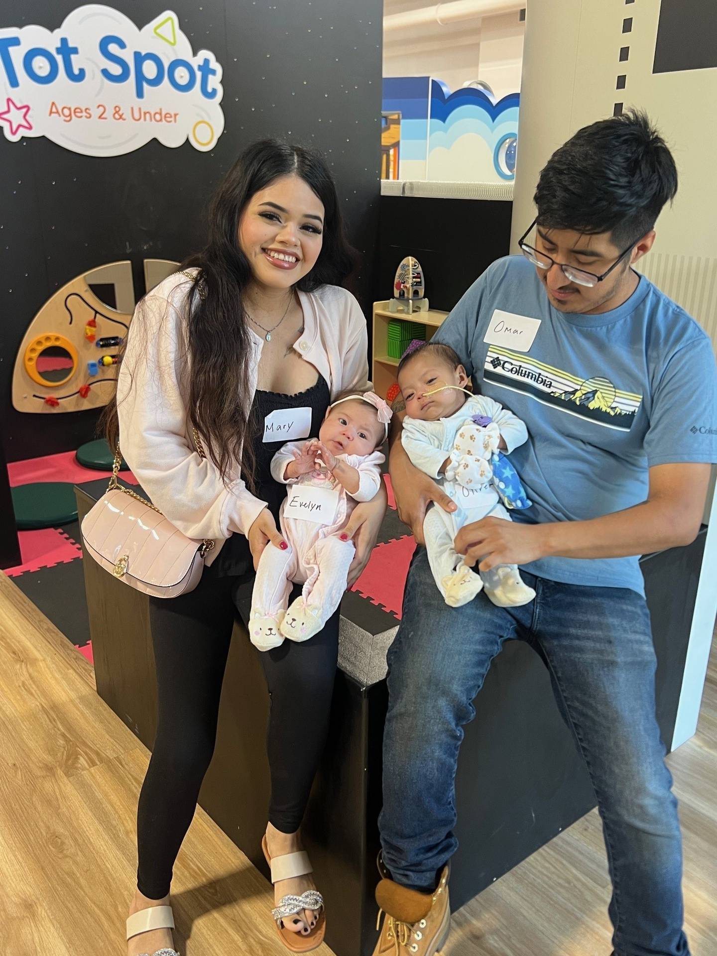 Three-month-old twins Evelyn and Oliver Omar pose with their parents Mary and Leon at the second reunion of graduates of Silver Cross Hospital's Amy, Matthew and Jay Vana Neonatal Intensive Care Unit and the babies’ immediate families on Sunday, Sept. 14, 2025 at the KidsWork Museum in New Lenox.
