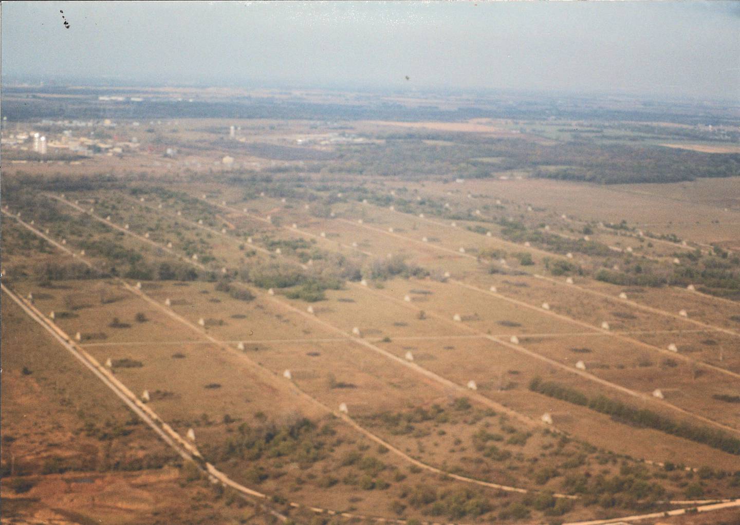 Pictured is a bunker field at the site of the former Joliet Arsenal. John Reddy, former arsenal worker and volunteer at Midewin National Tallgrass Prairie, took this photo around 1996. The family donated it to Midewin after Reddy's death.