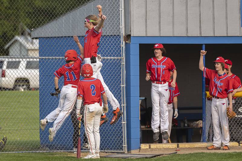 Morrison’s Jake Reed (left) and Brenden Martin celebrate a run against AFC Wednesday, May 17, 2023.