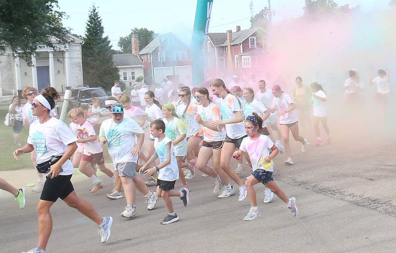 Runners sprint out of the starting line during the Arukah Institute of Healing Freedom Color Run on Friday, July 4, 2025 at Soldiers and Sailors Park in Princeton.