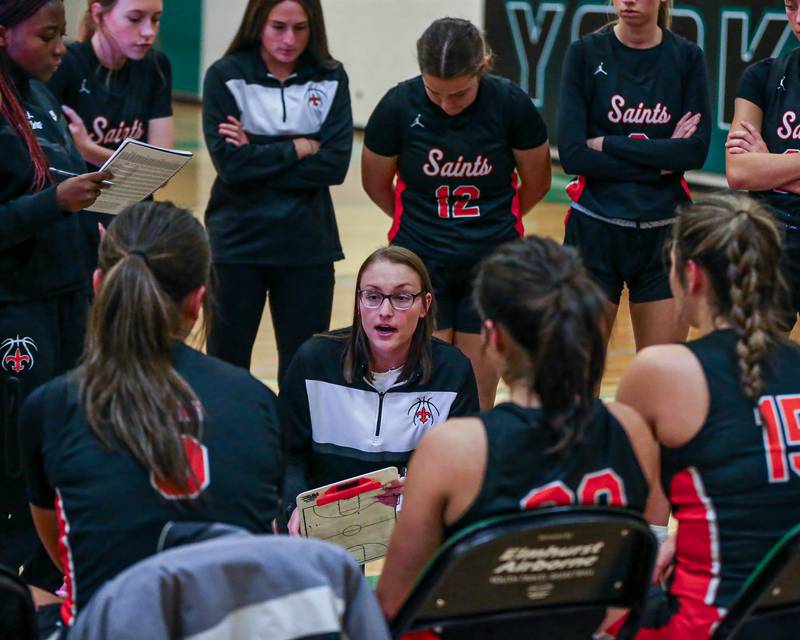 St Charles East's head coach Katie Claussner instructs the team during a timeout at the York Thanksgiving Tournament. Nov 13, 2023.