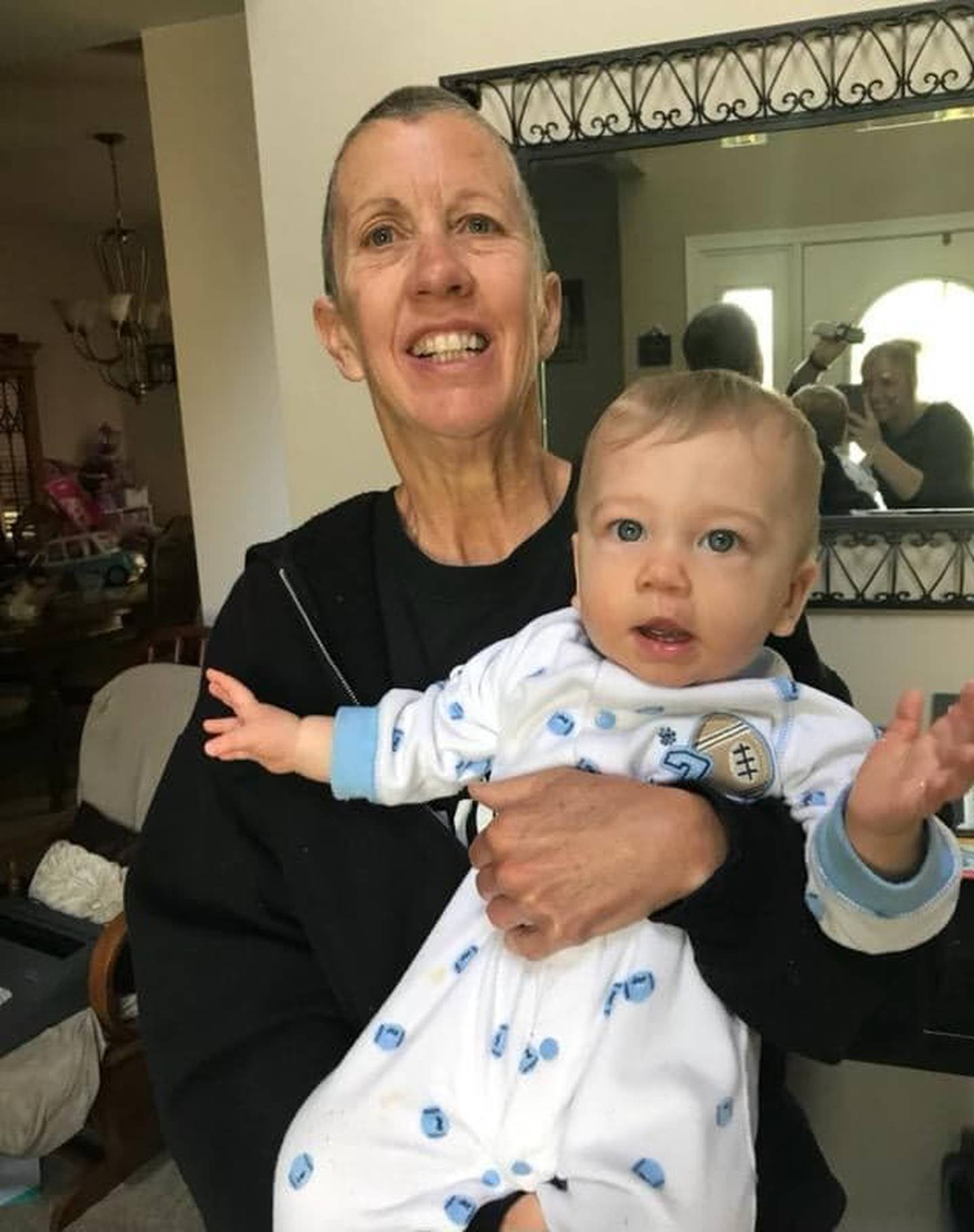Timbers of Shorewood volunteer Joni Hilger holds her grandson Kayden. Joni absolutely loved being a grandmother.