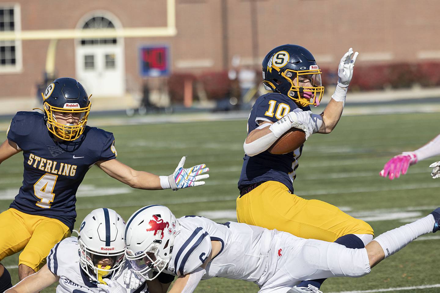 Sterling’s Cole Ledergerber escapes tacklers in the first round playoff game Saturday, Oct. 29, 2022 against St. Viator.