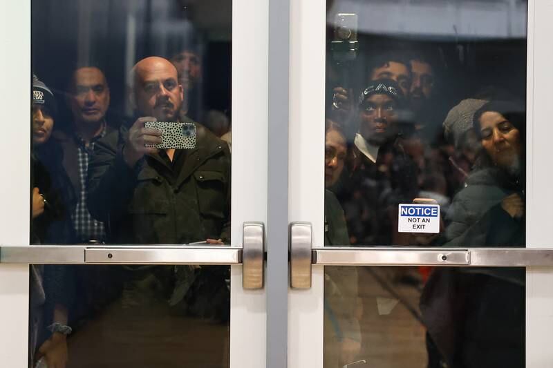 Dozens of supporters stand outside as the gym reached maximum capacity at a vigil for Wadea Al-Fayoume at Prairie Activity & Recreation Center on Tuesday, Oct. 17, 2023 in Plainfield.