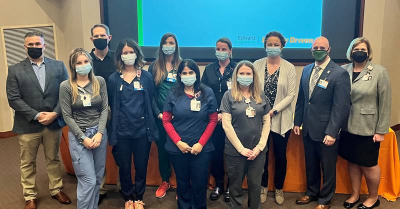 The Edward Foundation has awarded $26,000 in nursing scholarships to 13 Edward Hospital employees who are pursuing a degree or advanced degree in nursing. Pictured are (front, from left): Lindsay Cerchio, RN; Christina Deacy, RN; Prerna Malhotra, RN and Nicole Ticknor, LPN; and (back from left): Louis Sands, Edward Foundation Board Chair;John Walwer, RN; Faith Almieri, RN; Sandi Darnell, RN; Natasha Oehlerking, RN;Brett Skeen, Executive Director, Edward Foundation and Trish Fairbanks, Associate VP/Chief Nursing Officer, Edward Hospital. Not pictured:Lee Ann Grabon, RN; Kati Sibenaller, RN; Jada Sims, RN; Mercedes Strezo, PCT and Rachel Walker, RN.