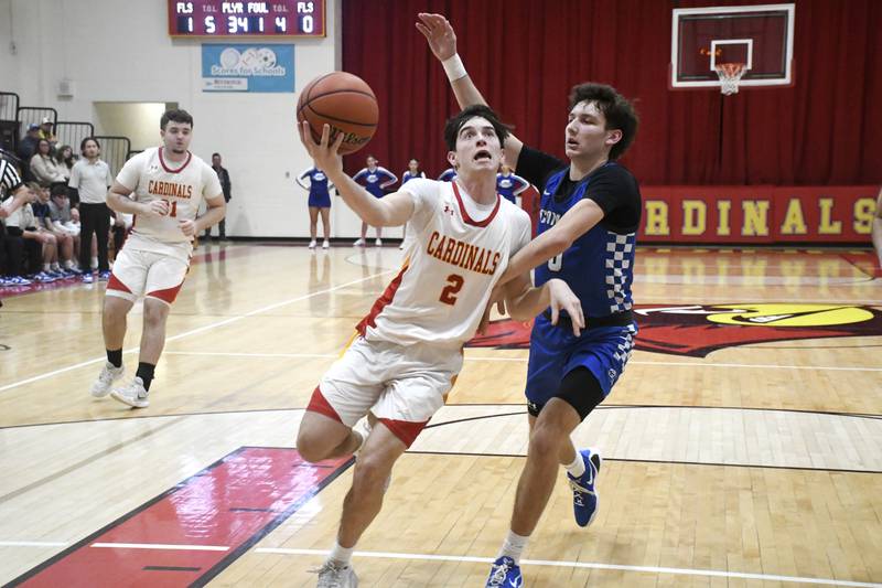 St. Anne's Matthew Langellier goes up for a layup while being contested by Clifton Central's Derek Meier during St. Anne's 61-56 victory over Clifton Central on Tuesday January 6, 2026.
