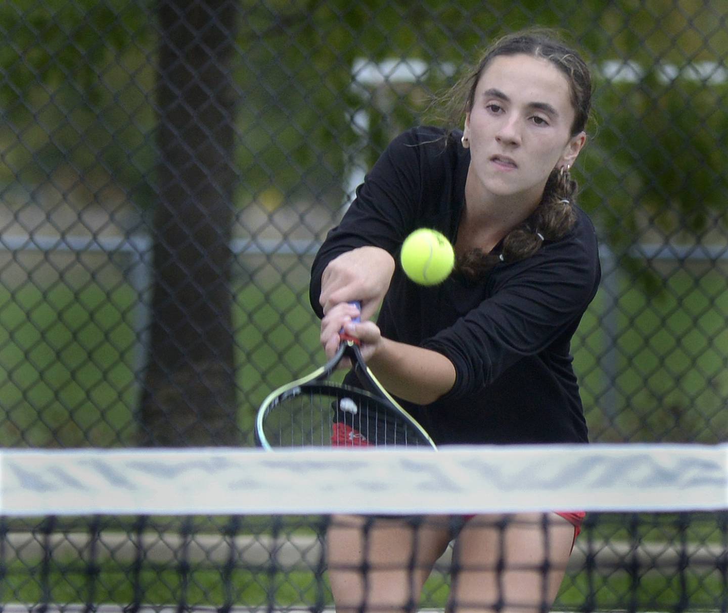 Ottawa’s Layne Krug during singles play against LaSalle Peru’s Eva Cervantes Saturday during the IHSA Tennis Sectional in LaSalle