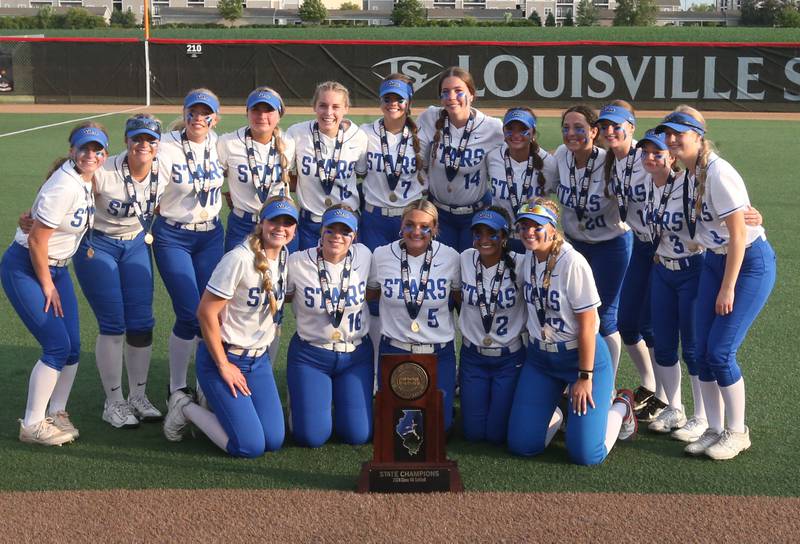 Members of the St. Charles North softball team pose with the Class 4A championship trophy after defeating Marist on Saturday, June 8, 2024 at the Louisville Slugger Sports Complex in Peoria.