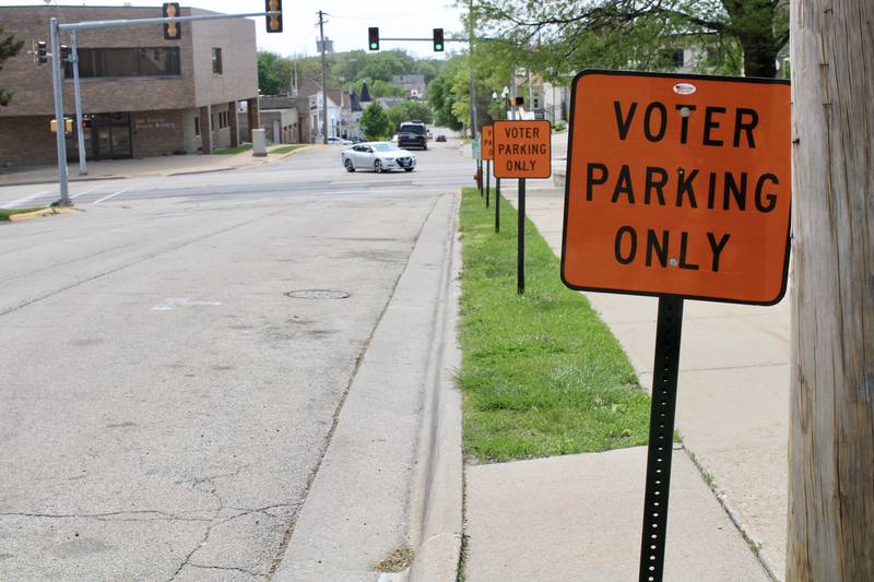 Designated parking spaces for early voters are unoccupied Thursday afternoon along the East Third Street entrance to the Old Lee County Courthouse in Dixon.