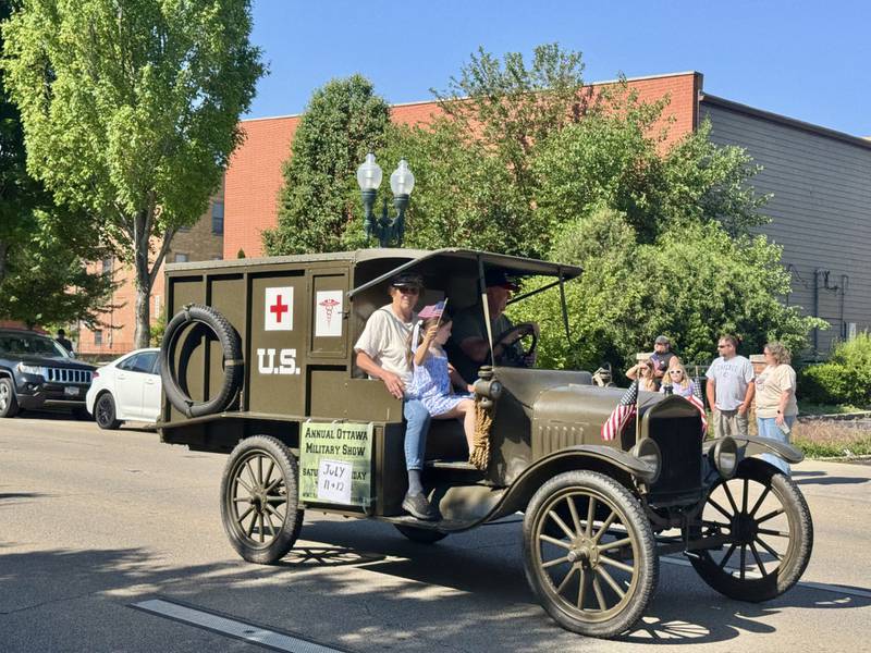 A vintage military vehicle rolls down the parade route during Ottawa's Memorial Day observance Monday, May 25.