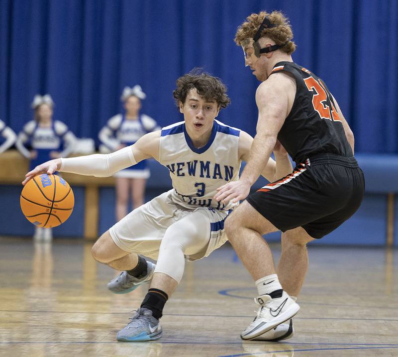 Newman’s Garret Matznick handles the ball against Milledgeville’s Spencer Nye Monday, Feb. 24, 2025, during a Class 1A Regional quarterfinal at Newman High School.