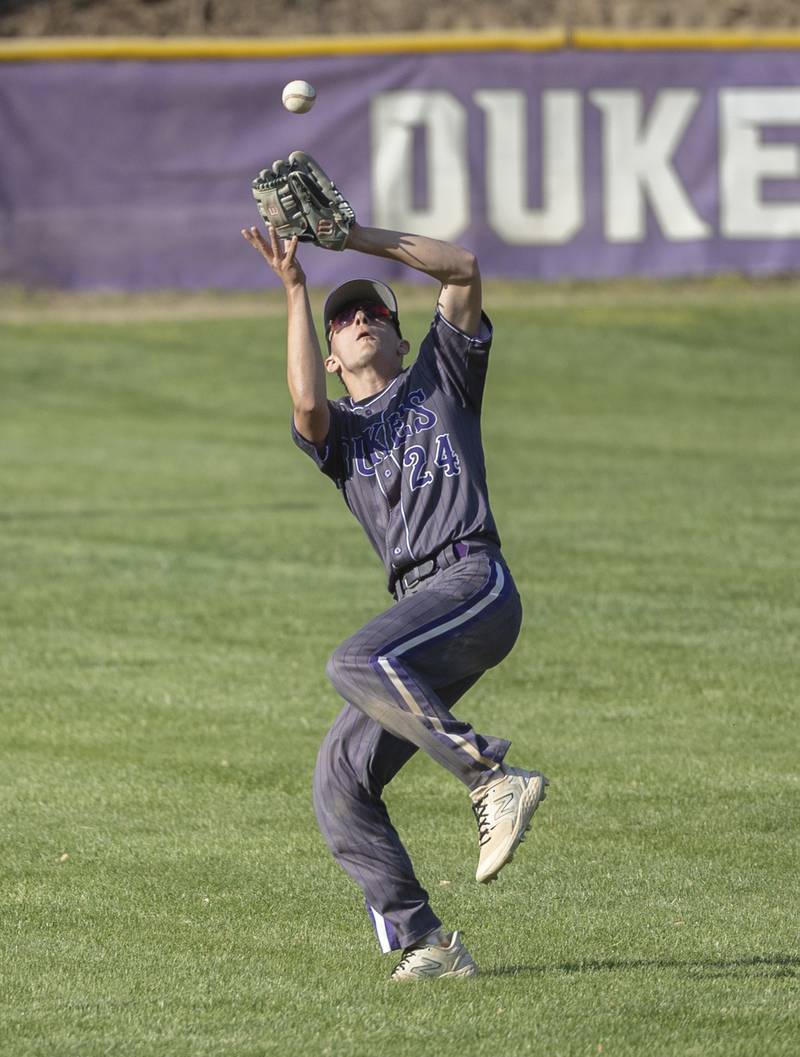 Dixon’s Brady Feit goes back for a catch against Sterling Friday, May 23, 2025.