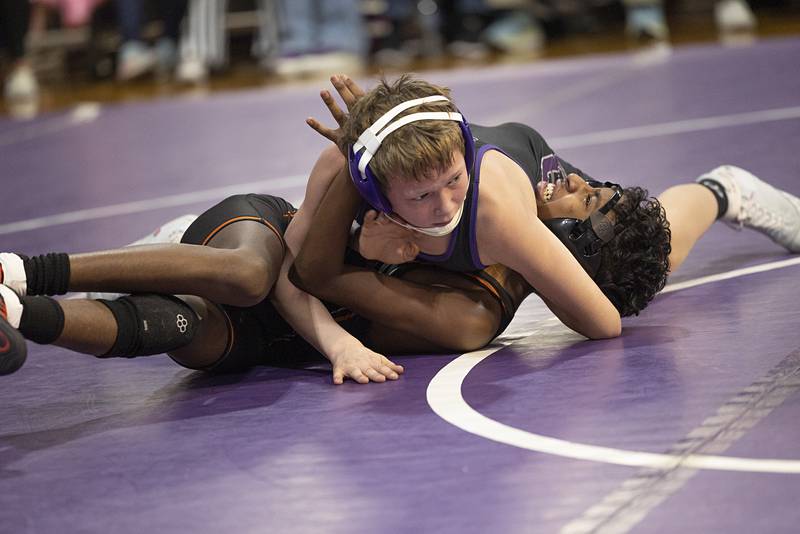 Dixon’s Ryan Rill pins Freeport’s Yehezqel Nyatangi Tuesday, Jan. 13, 2025, during a triangular meet with Sterling.