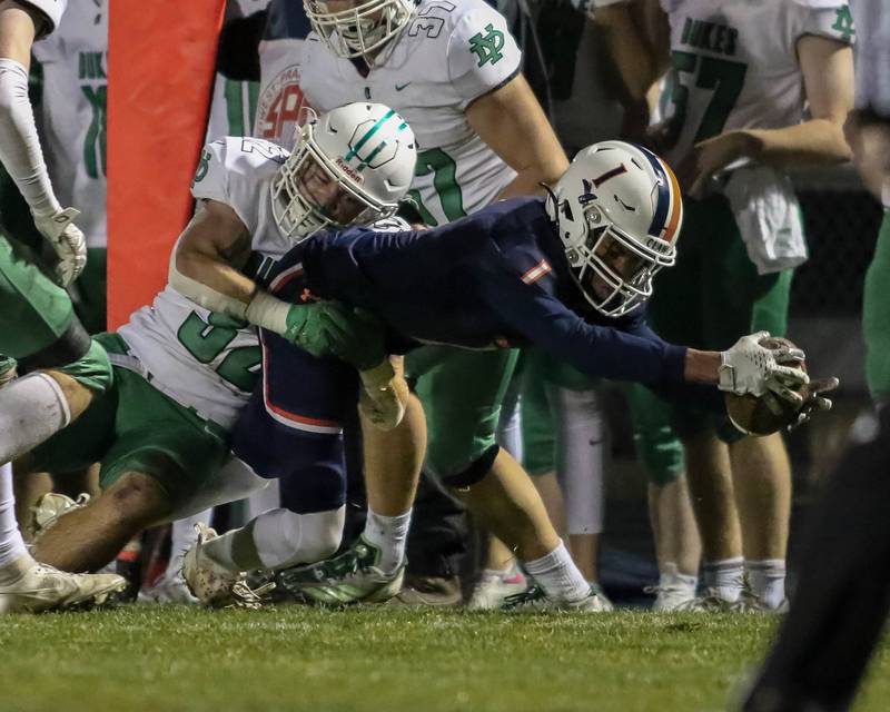 Oswego's Jermemiah Cain (1) reaches out for extra yards during Class 8A second- round football game between York at Oswego on Friday, Nov 8, 2024  in Oswego.