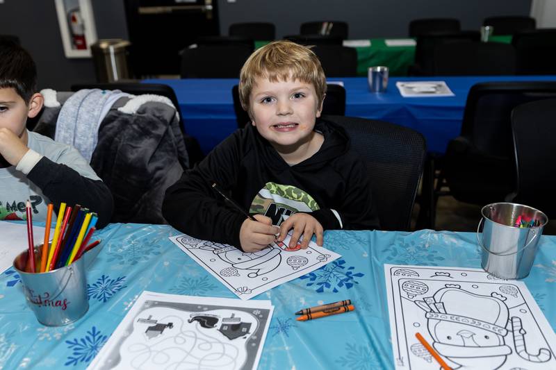 Crest Hill resident Keith Kinney Jr. works on holiday-themed crafts during Winterfest at Crest Hill City Center on Nov. 30, 2024.