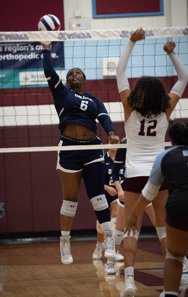 Grace Christian's Miranda Glenn delivers a hit over the net as Kankakee's Malea Harrison defends in a match on Monday, September 22, 2025.