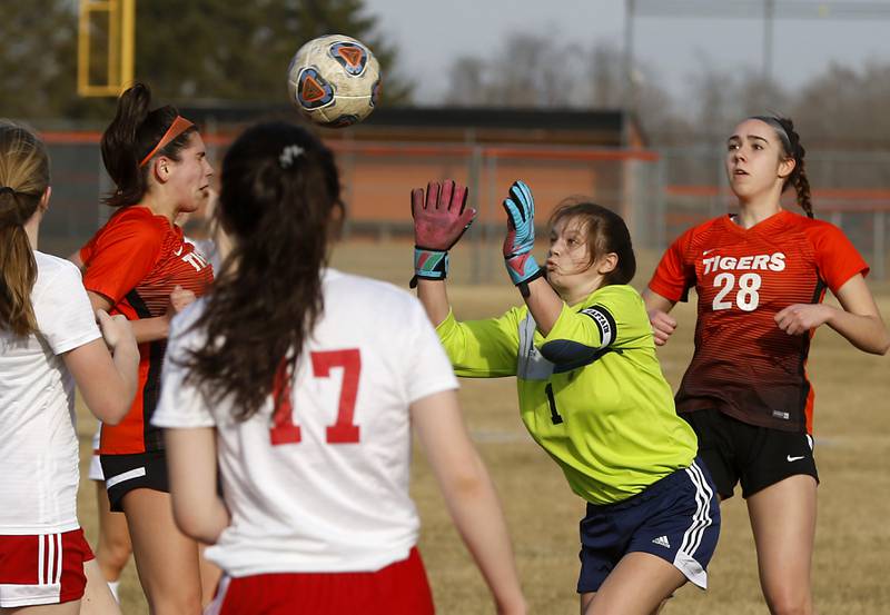 Marian Central's Anna Lingle tries to get get to the ball that was hit towards the goal by Crystal Lake Central's Kaitlin Gaunaurd during a non-conference soccer match Monday, March 21, 2022, between Crystal Lake Central and Marian Central at Crystal Lake Central High School.