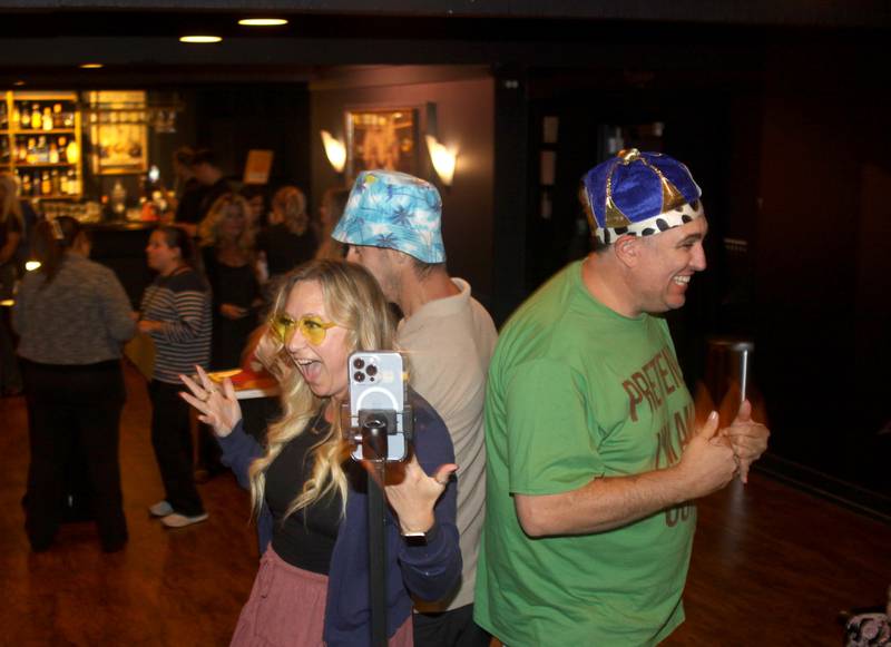 Radio personalities Tina Lawrence, left, and Joe Cicero, right, enjoy the 360-degree Photo Booth during the Shaw Local Media Best of the Fox celebration at Lou’s Lounge at the Dole in Crystal Lake on Thursday, Sept. 18, 2025.
