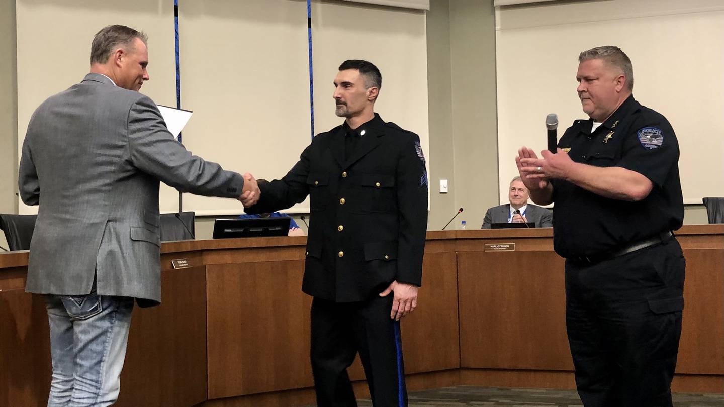Hand shake between Frank Sterioti at a village board meeting March 15.