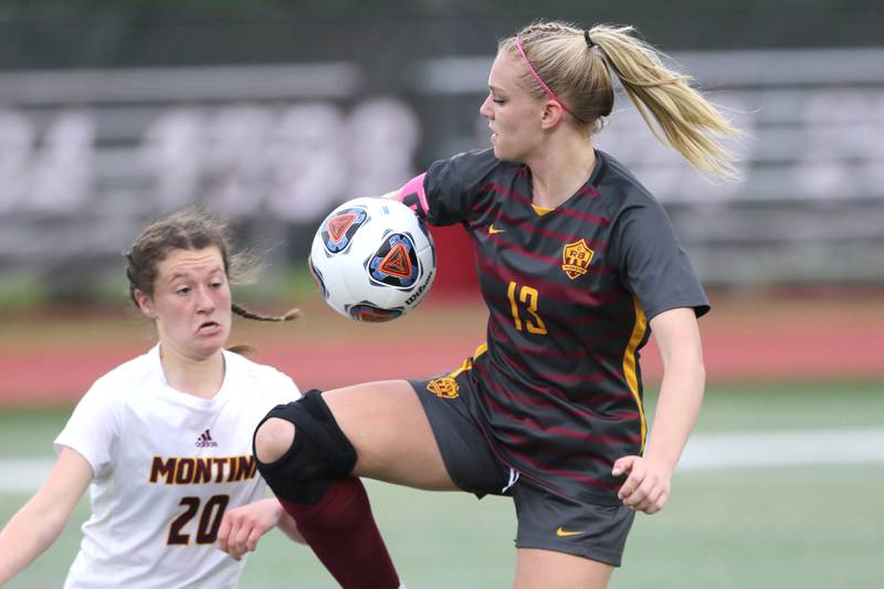 Richmond-Burton's Jordan Otto hits the ball in the air in front of Montini's Jillian Parrilli Friday, May 27, 2022, during their IHSA Class 1A state semifinal game at North Central College in Naperville.