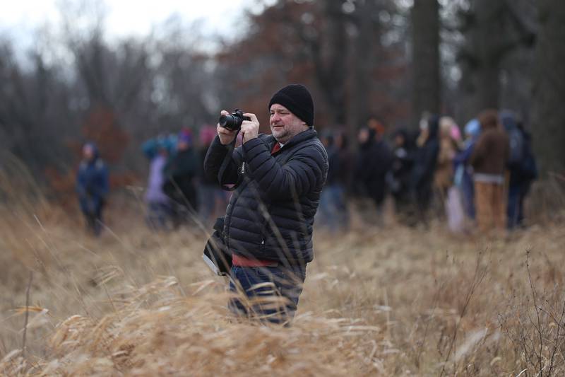 Jeff Zarinelli takes photos of two Bald Eagles flying over the river at Four Rivers Environmental Education Center’s annual Eagle Watch on Saturday, Jan 10, 2026 in Channahon.