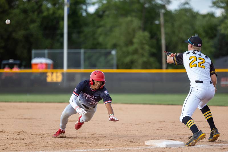Adan Pantoja of Illinois District 20 slides back to first base as Bryan Degen attempts to tag him out on Saturday, July 12, 2025 at Washington Park in Peru.