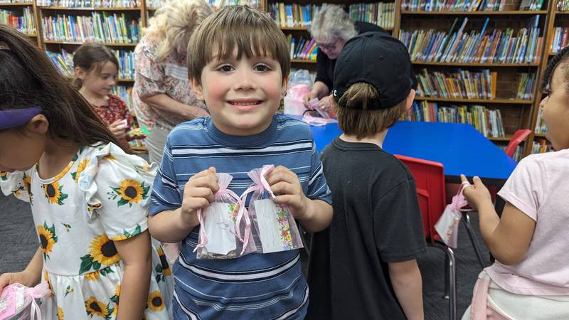 On April 15, volunteers from two Joliet nonprofits – the Zonta Club of Joliet and Visitation and Aid Society – hosted a “jewelry gift shop” of gently used bracelets earrings, necklaces for the students at Edna Keith, M.J. Cunningham Elementary, and Sator Sanchez and Thomas Jefferson elementary schools to give on Mother’s Day. Sean Vargas-Martinez was excited to surprise him mom with his gifts.