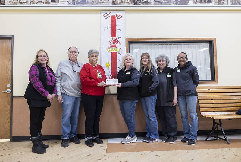 On Monday, Jan. 20, 2025, Dixon County Market donated $13,833. 21 to the Dixon Food Pantry as part of their annual Hope Bag food drive. Pictured: Julie Duckworth (left), store director, food pantry representatives Wylie Fox and Josie Whaley, customer service manger Cristine Love and checkers Melody Helfrich, Rachel Utz and Teria Scott.