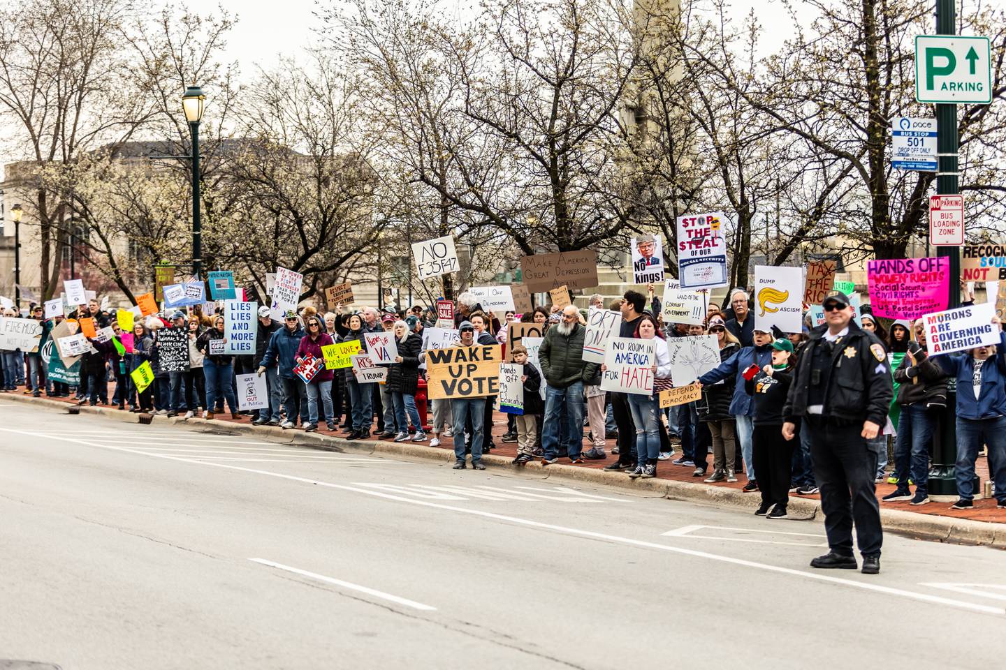 Attendees line Jefferson Street in downtown Joliet during the Hands Off protest on April 5, 2025. The rally was part of a nationwide movement on Saturday to protest policies and actions of the Trump administration and Elon Musk.