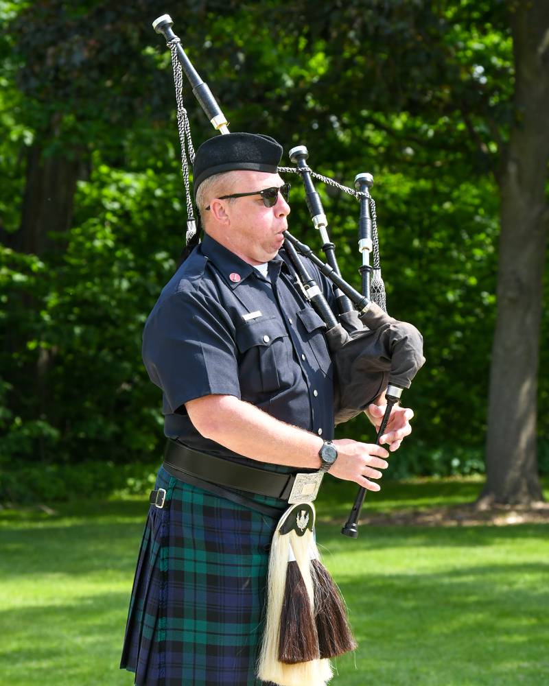 Tom Conley of DeKalb plays Amazing Grace on the bagpipes during the Memorial Day ceremony held at the Ellwood lawn in DeKalb on Monday May 30th.