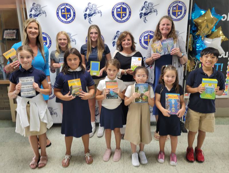 The Marseilles Rotary Club on Tuesday completed its donation of 352 "wish list" books to Marseilles, Milton Pope, Rutland and Marquette Academy grade schools. Shown are (front from left) MA students MaKynlee Diss, Millie Babiak, Ellie Babiak, Angel Tran, Char Pointer and Josiah Alix; (back from left) Rotary's Amanda Hart, students Lily Hall and Kinley Rick and the Rotary's Linda Taglia and Sherri Laitila.