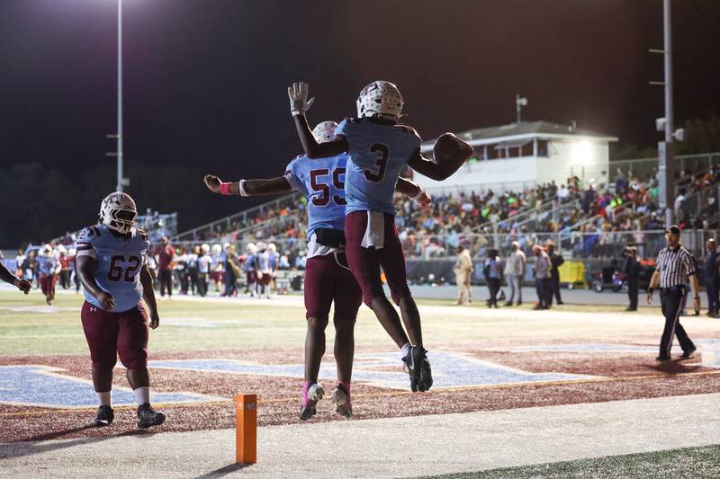 Kankakee's Cedric Terrell lll jumps to celebrate his touchdown with teammate Keaire Smith during the Kay's victory over Bloom on Friday, Oct. 10, 2025.