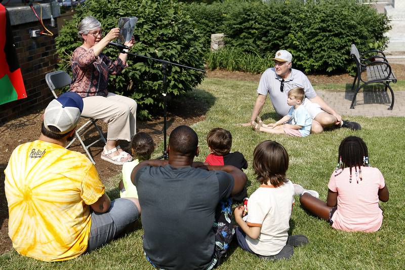 Arlene Lynes of Read Between The Lynes  reads a book about Juneteenth during McHenry County’s first Juneteenth celebration on Saturday, June 17, 2023, at the Historic Woodstock Square. The Juneteenth festival featured McHenry County College graduate Rodney Katushabe and Pastor Norval Brown of the Cary United Methodist Church, along with music from gospel singer Darlene Benton and jazz musician Ken Davis.