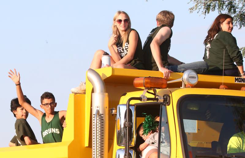 Members of the St. Bede cross country team ride ride in the St. Bede Homecoming Parade on Friday, Sept. 29, 2023 at St. Bede Lane.