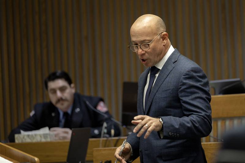 Attorney Michael Kosner, representing Brittany Ramos, speaks with Rock Falls firefighter Brian McPhillips on Wednesday, Nov. 5, 2025, on the stand in Whiteside County Court.