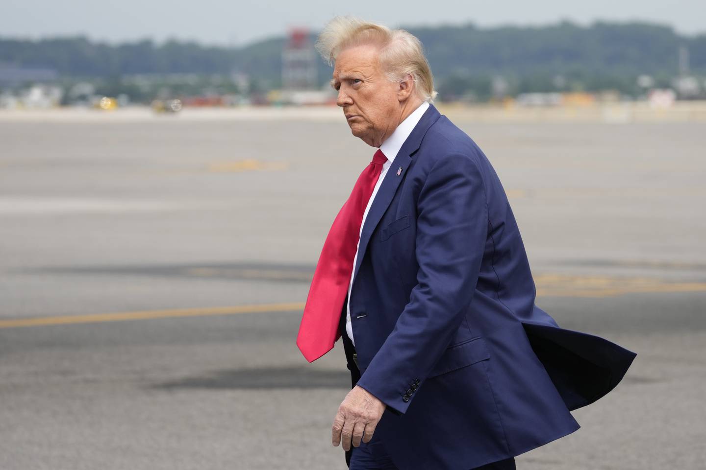 Former President Donald Trump arrives at Ronald Reagan Washington National Airport, Thursday, Aug. 3, 2023, in Arlington, Va., as he heads to Washington to face a judge on federal conspiracy charges alleging Trump conspired to subvert the 2020 election.