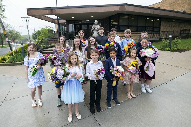 St. Mary students who “best exemplify Catholic values” were honored Thursday, May 1, 2025, to offer flowers to the Blessed Virgin Mary on Wednesday, April 30, 2025, outside of the school in Dixon.