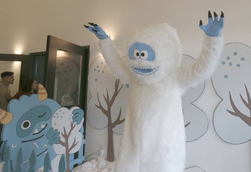 Abominable snowman greets kids during the Miracle on First Street at Ax Church on Saturday, Dec. 6, 2025 in La Salle.
