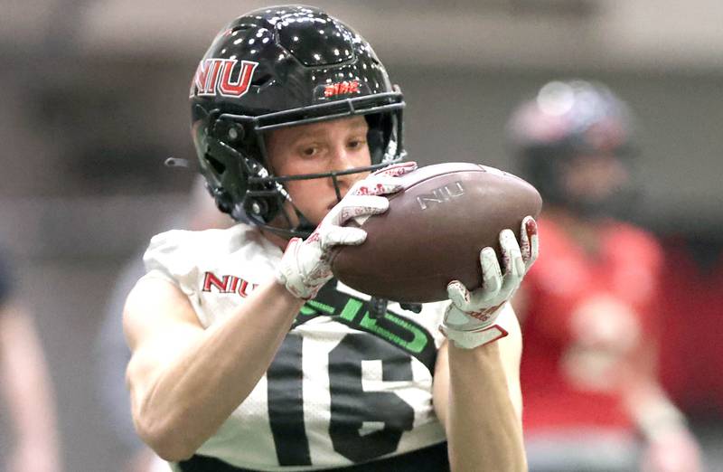 Northern Illinois receiver Jalen Johnson catches a pass during the teams first spring practice Wednesday, March 22, 2023, in the Chessick Practice Center at Northern Illinois University in DeKalb.