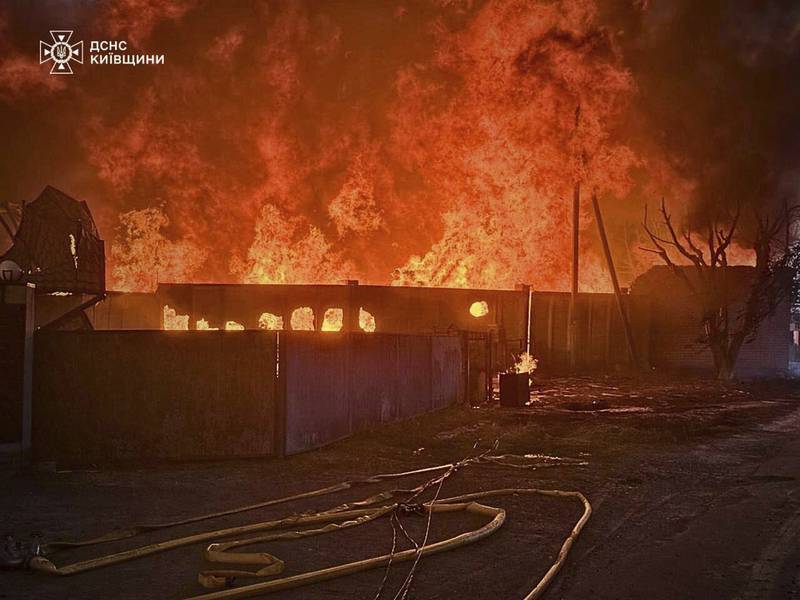 This photo provided by the Ukrainian Emergency Service shows a fire following a Russian attack in Kyiv region, Ukraine, Wednesday, July 9, 2025. (Ukrainian Emergency Service via AP)