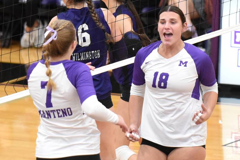 Manteno's Maddie Gesky, right, celebrates a point with Panthers teammate Leah Milton during a home game against Wilmington Tuesday, Oct. 7, 2025.