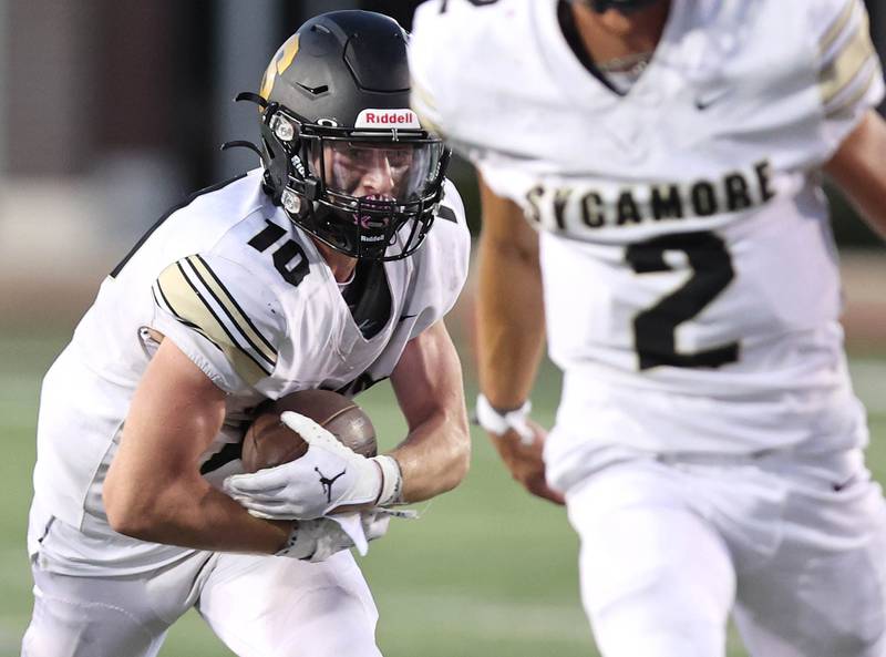 Sycamore's Zack Crawford finds a hole in the DeKalb line during the First National Challenge Friday, Aug. 26, 2022, in Huskie Stadium at Northern Illinois University in DeKalb.