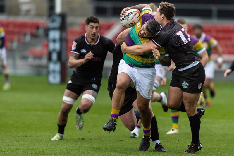 Chicago Hounds' outside center Bryce Campbell, tries to tackle New Orleans Gold's prop Matt Harmon, during a rugby match at Seat Geek Stadium in Bridgeview, on Sunday April 23, 2023.