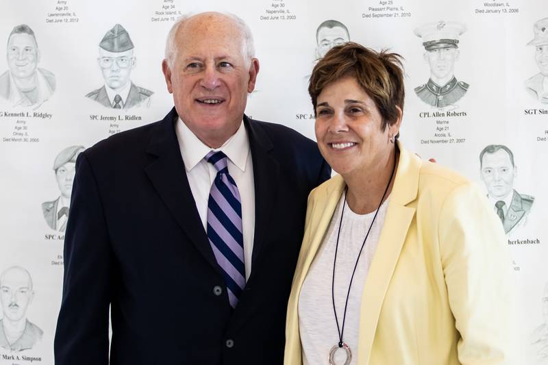 Former Governor Pat Quinn and Will County Executive Jennifer Bertino-Tarrant take a photo at the 'Portrait of a Soldier' exhibit at the Will County Courthouse in Joliet, Illinois on Sept. 11, 2025.