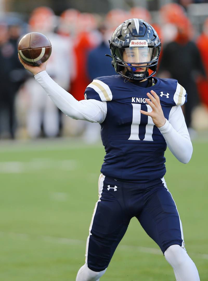 IC Catholic's Dennis Mandala (11) passes the ball during a Class 3A varsity football semi-final playoff game between Byron High School and IC Catholic Prep on Saturday, Nov. 19, 2022 in Elmhurst, IL.